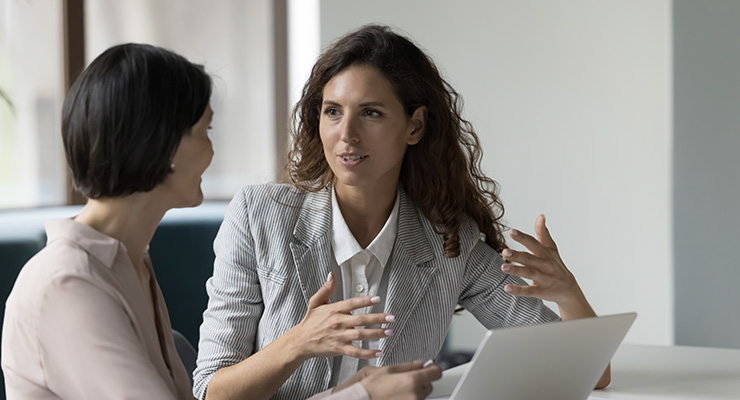 Executive giving feedback to her employee