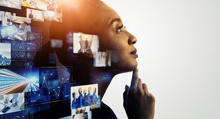 Woman looking up in wonder with abstract business symbols floating