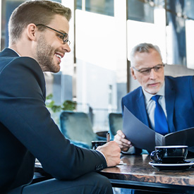 Two businessmen discussing