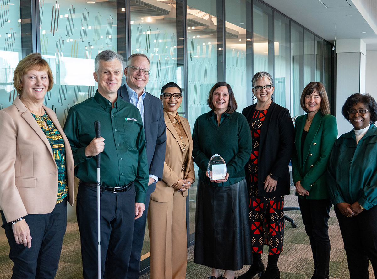 CUES CEO Heather McKissick, University of Michigan CU CEO and CUES board member Tiffany Ford, and MSUFCU board members at the celebration for April Clobes.