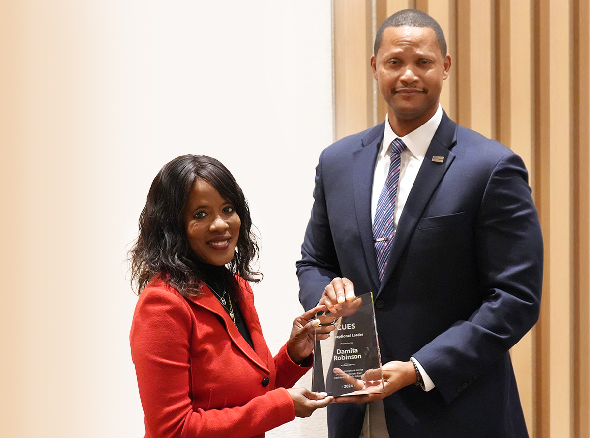 CUES Vice Chair Mark Robnett, CCE, GSLC, joined the celebration at Andrews Federal to honor Damita and present her with the award.