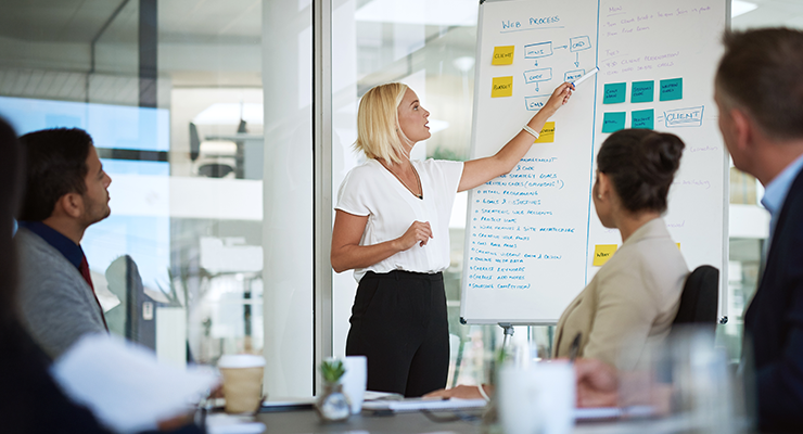 Female facilitator leading group workshop